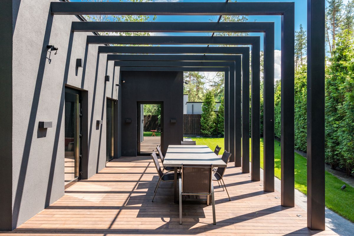 Patio with pergola structure and outdoor dining set